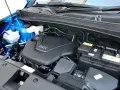 Silnik GDI w Kia Sportage (2015) z widocznym akumulatorem i płynami.