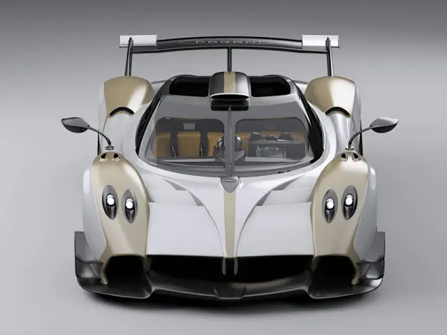 Pagani Huayra w kolorze białym ze złotymi akcentami, z dużym tylnym skrzydłem. Cena tego cudu motoryzacji jest astronomiczna.